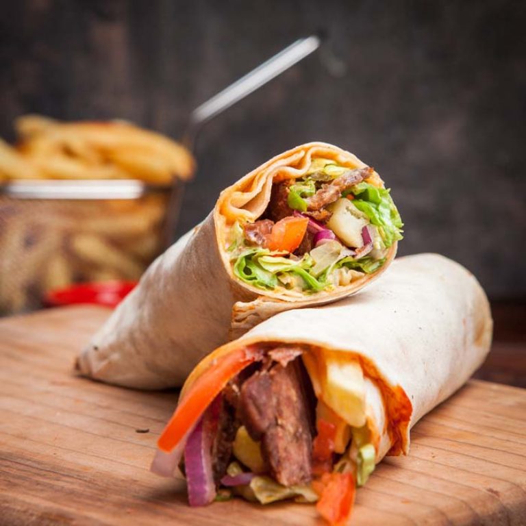 side-view-shawarma-with-fried-potatoes-in-board-cookware