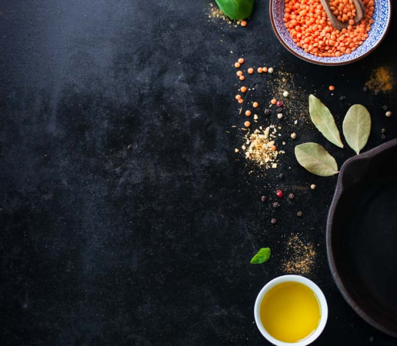 top-view-of-bowl-with-lentils-and-variety-of-condiments