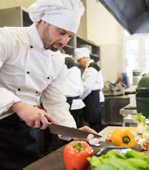 close-up-on-chef-cooking-in-restaurant-kitchen